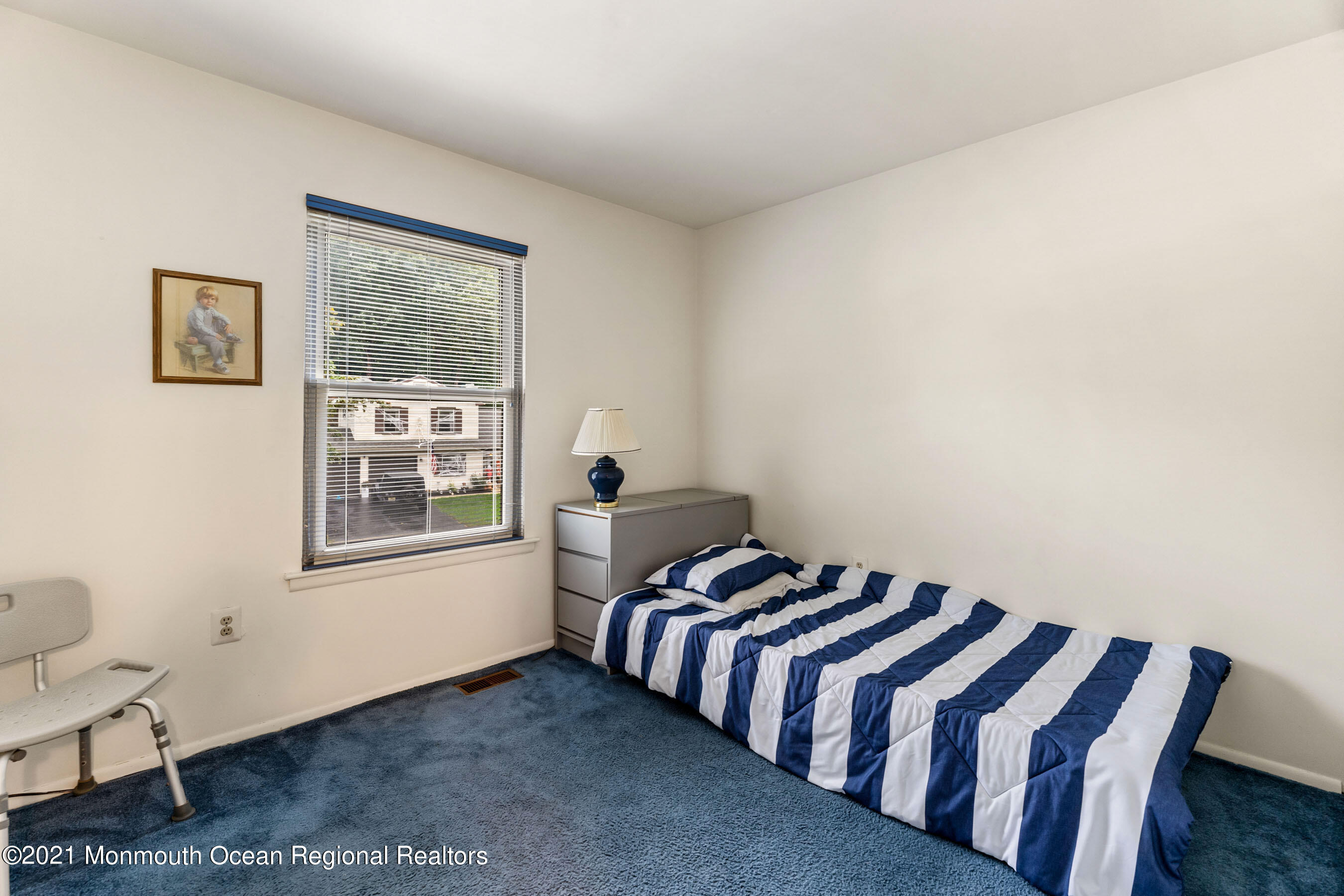 11 Flintlock Drive Howell, NJ 07731 - Photo 19 of 29 a bedroom with a bed and wooden floor