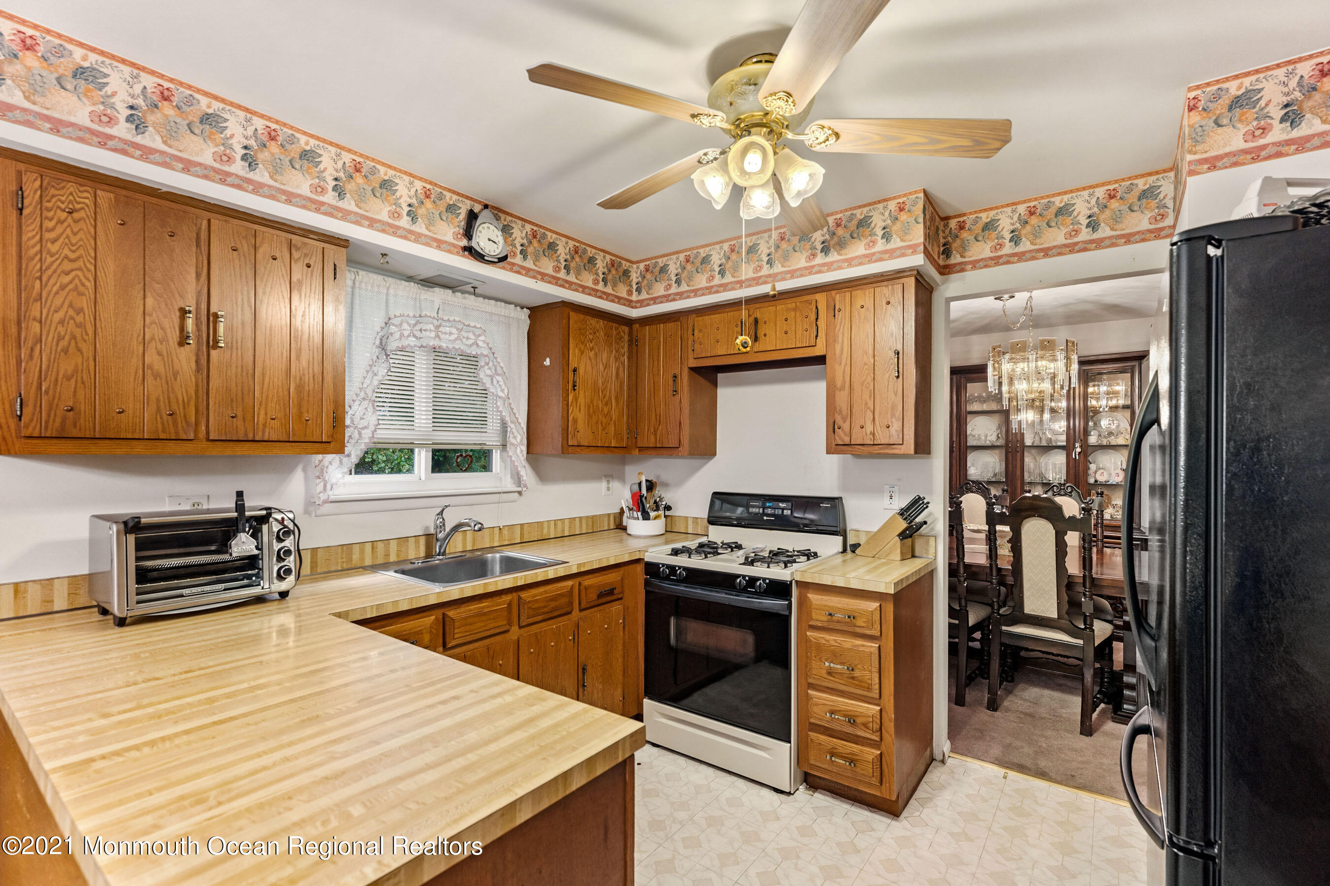 11 Flintlock Drive Howell, NJ 07731 - Photo 3 of 29 a kitchen with stainless steel appliances granite countertop a stove a sink and a refrigerator