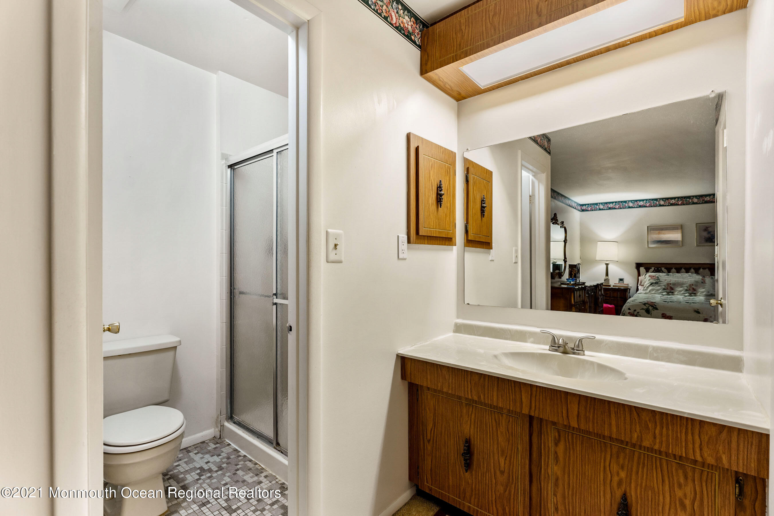 11 Flintlock Drive Howell, NJ 07731 - Photo 22 of 29 a bathroom with a sink and a mirror