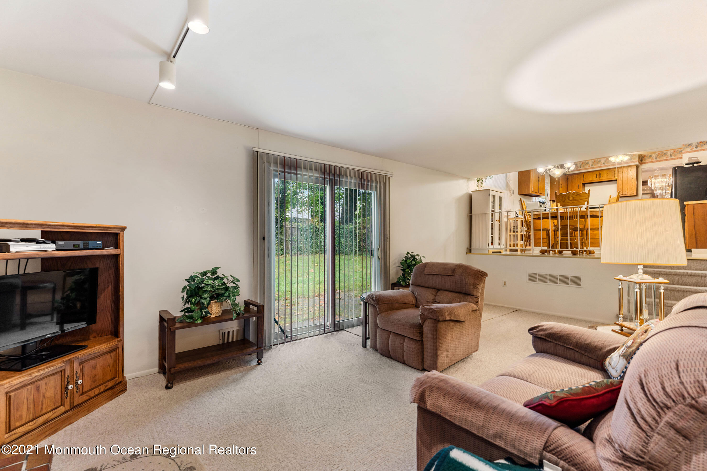 11 Flintlock Drive Howell, NJ 07731 - Photo 7 of 29 a living room with furniture flat screen tv and a fireplace
