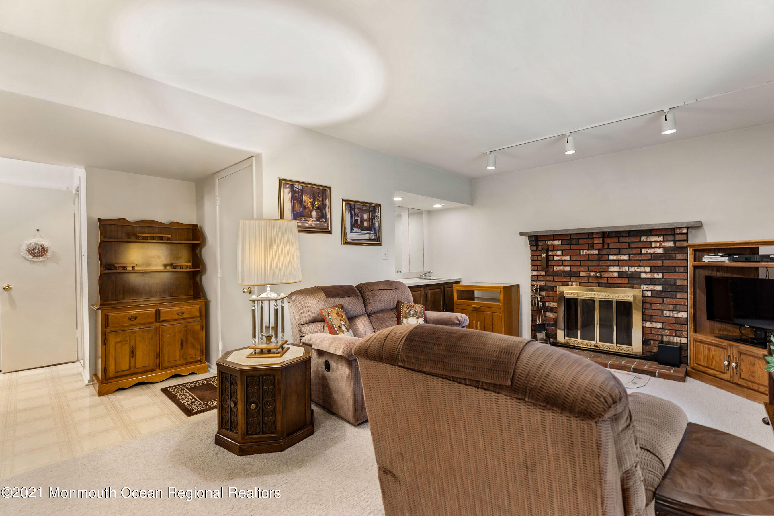 11 Flintlock Drive Howell, NJ 07731 - Photo 8 of 29 a living room with furniture a flat screen tv and kitchen view