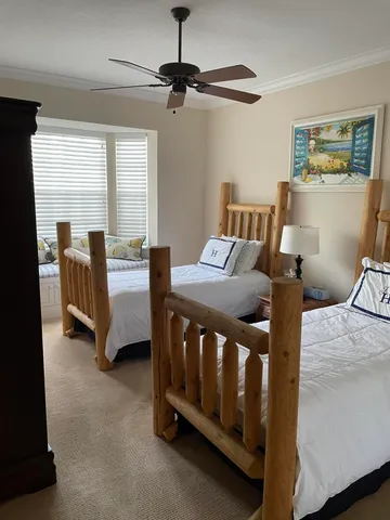 a bedroom with furniture and a window