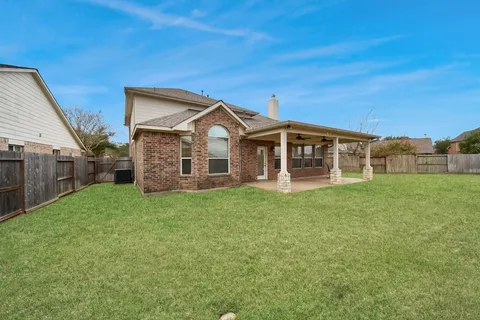 an aerial view of house with yard swimming pool and outdoor seating