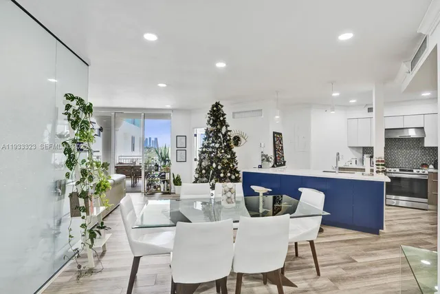 a living room with furniture and a christmas tree