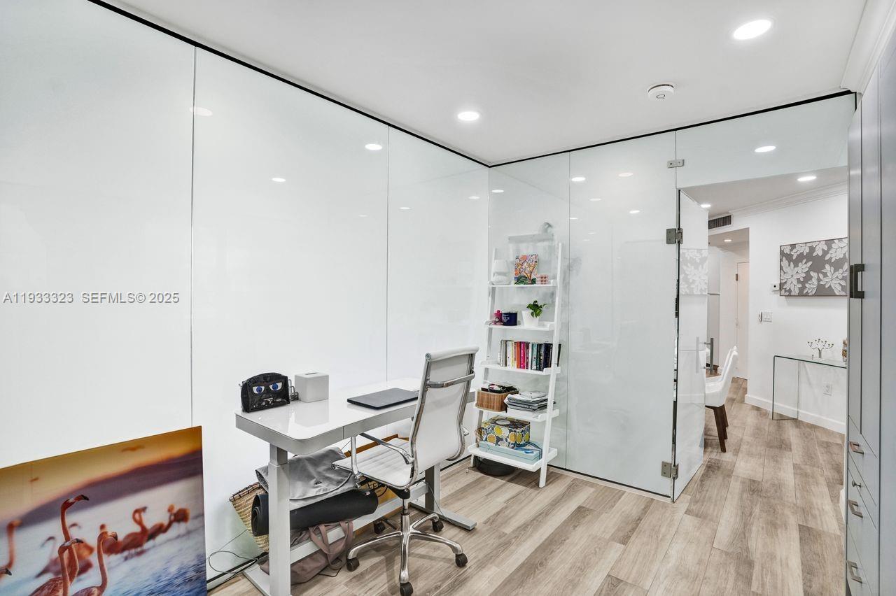 1 Century Lane, Unit 510 Miami Beach, FL 33139 - Photo 29 of 32 a workspace with furniture and wooden floor