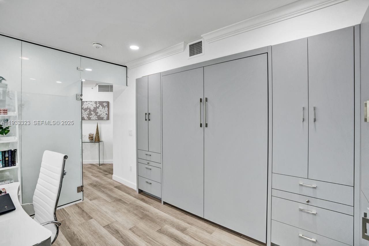 1 Century Lane, Unit 510 Miami Beach, FL 33139 - Photo 30 of 32 a view of a hallway with furniture and wooden floor