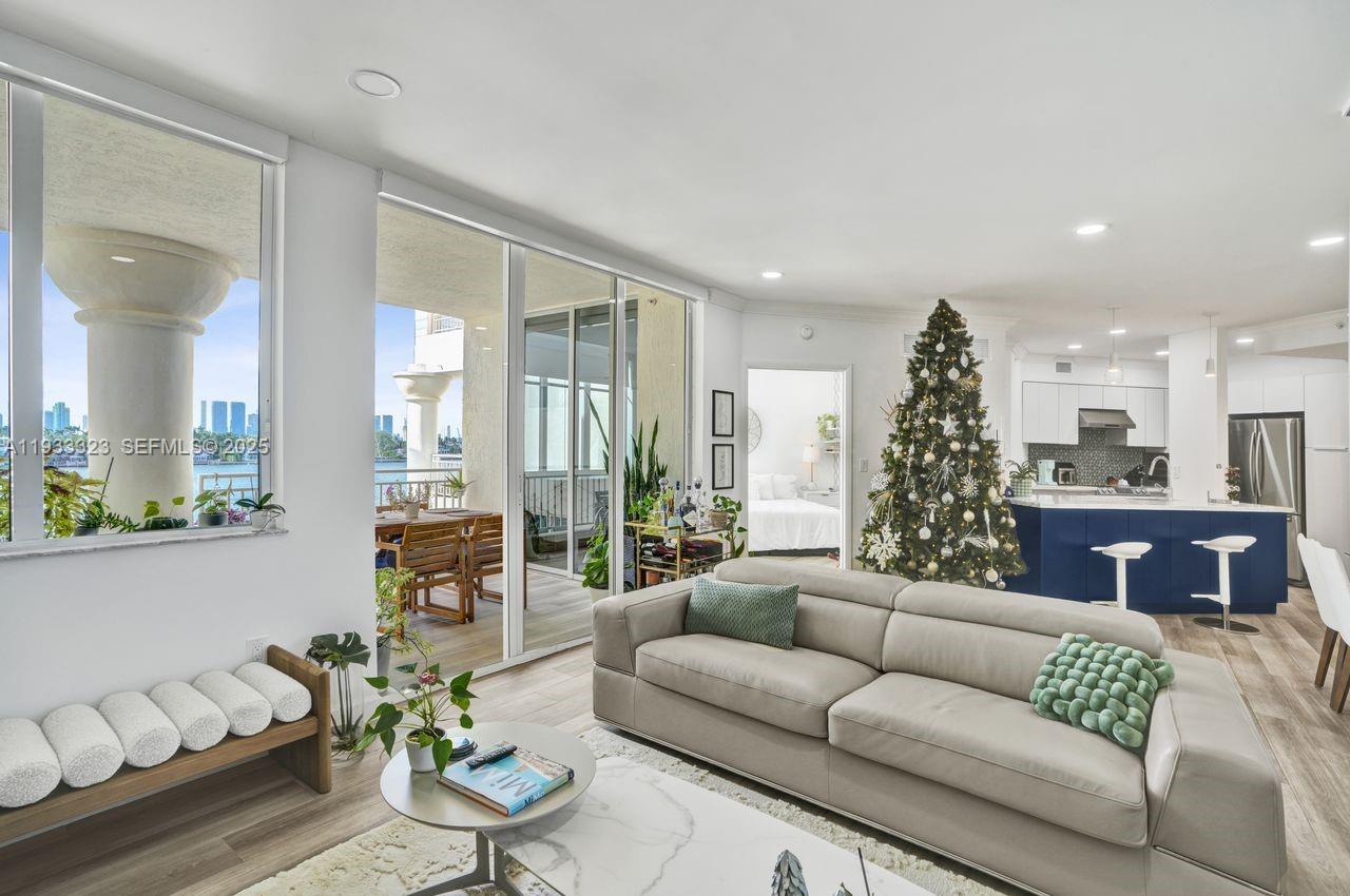 1 Century Lane, Unit 510 Miami Beach, FL 33139 - Photo 3 of 32 a living room with furniture and a large window