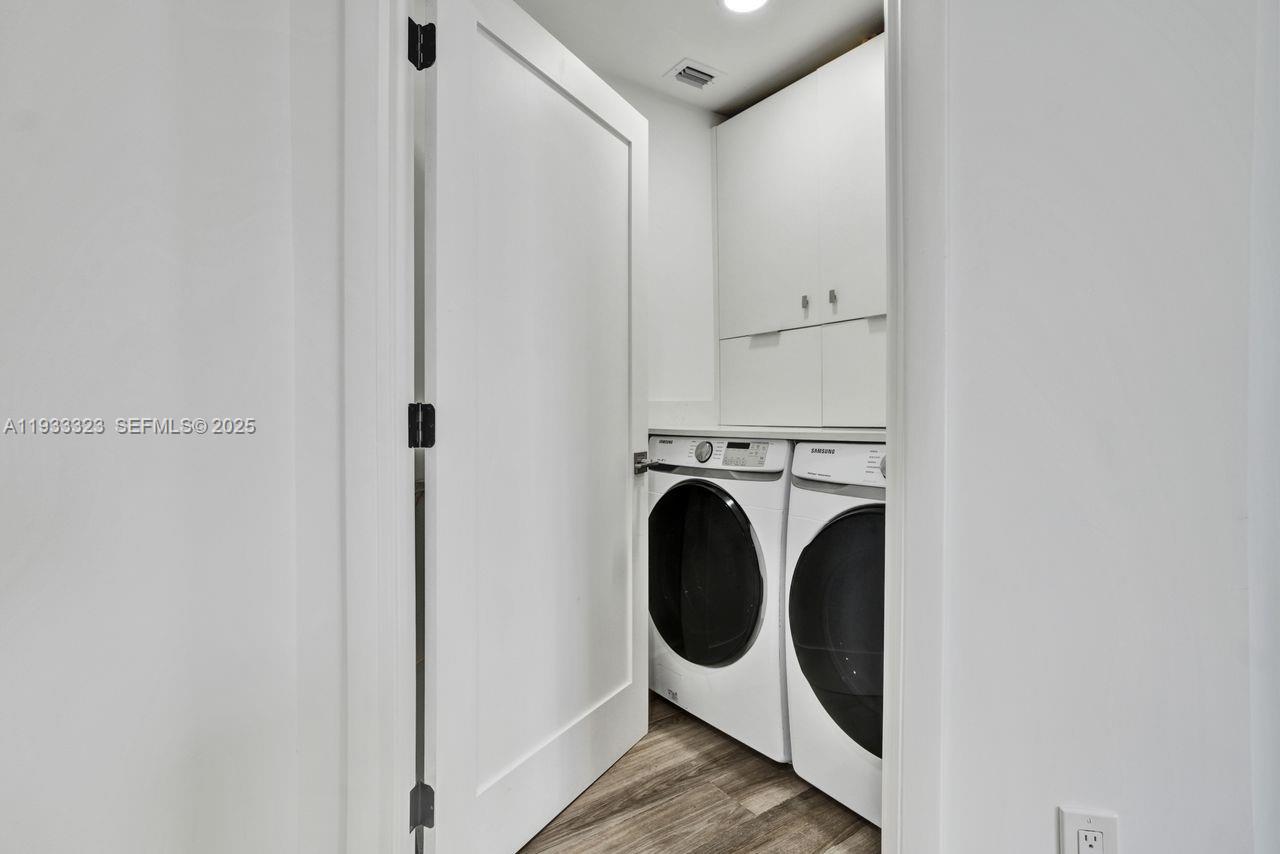 1 Century Lane, Unit 510 Miami Beach, FL 33139 - Photo 31 of 32 a utility room with dryer and washer