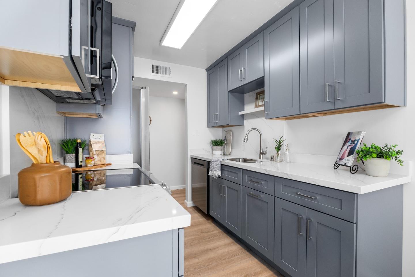 1925 46th Avenue, Unit 148 Capitola, CA 95010 - Photo 10 of 42 a kitchen with cabinets and appliances