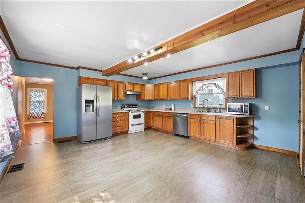 153 Wick Road Slippery Rock, PA 16057 - Photo 5 of 43 Very spacious 17x16 kitchen with room for a table and there is also a full dining room. All appliances are included.