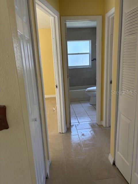 7544 Humboldt Avenue New Port Richey, FL 34655 - Photo 6 of 8 a view of a bathroom from a hallway
