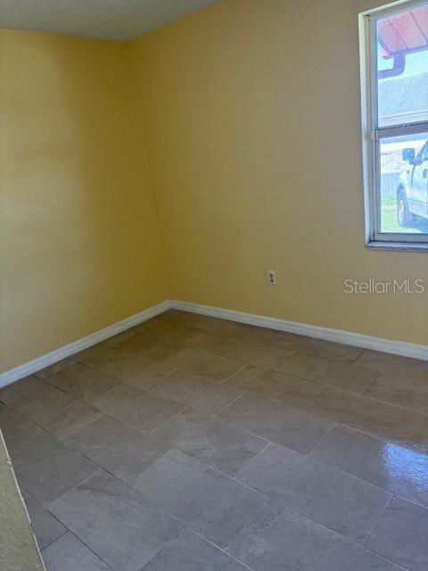 7544 Humboldt Avenue New Port Richey, FL 34655 - Photo 8 of 8 an empty room with a window