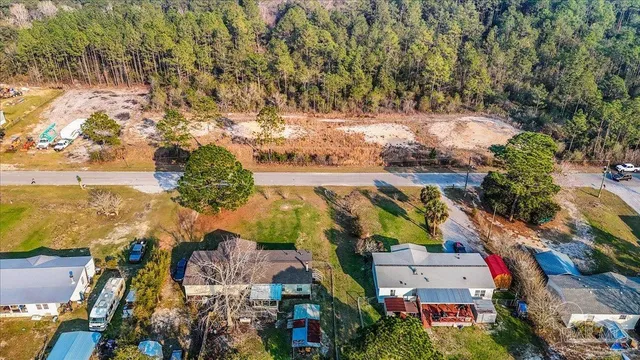 an aerial view of residential houses and outdoor space