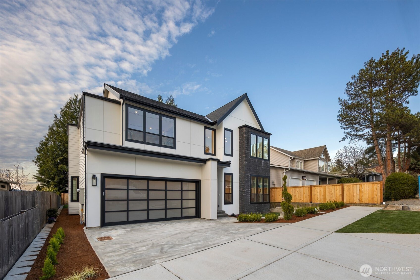1002 North 31st Street Renton, WA 98056 - Photo 1 of 5 a front view of a house with a yard