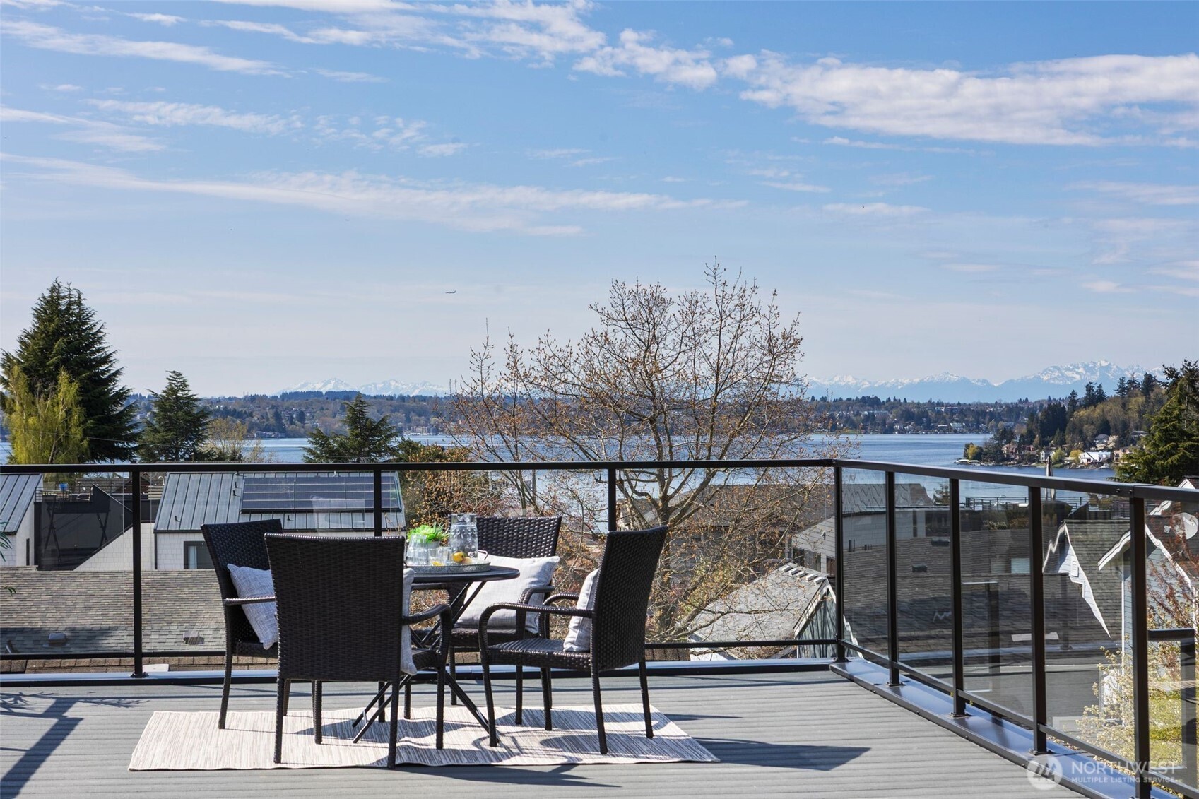 1002 North 31st Street Renton, WA 98056 - Photo 3 of 5 a view of a balcony with wooden benches