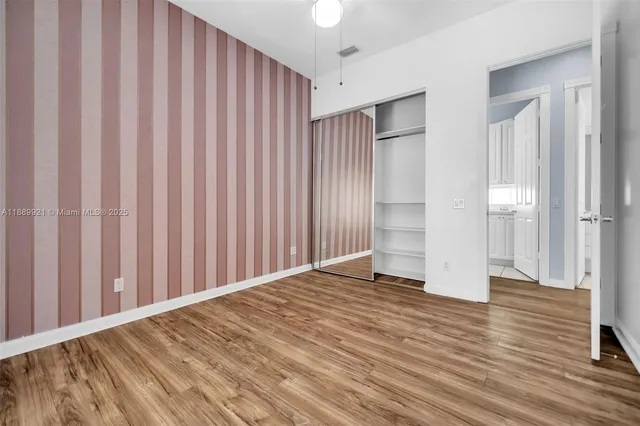 a view of a room with wooden walls