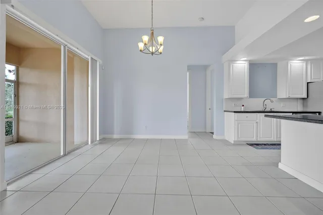 a view of a kitchen with a sink and a dishwasher cabinets