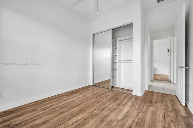 a view of wooden floor in an empty room