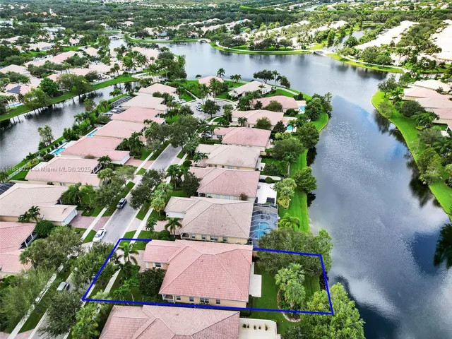 an aerial view of a house with a lake view
