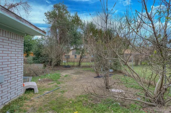 a backyard of a house with lots of green space
