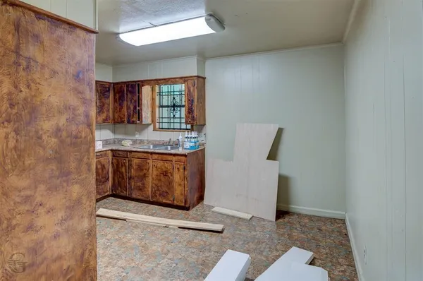 a room with a stove and a window