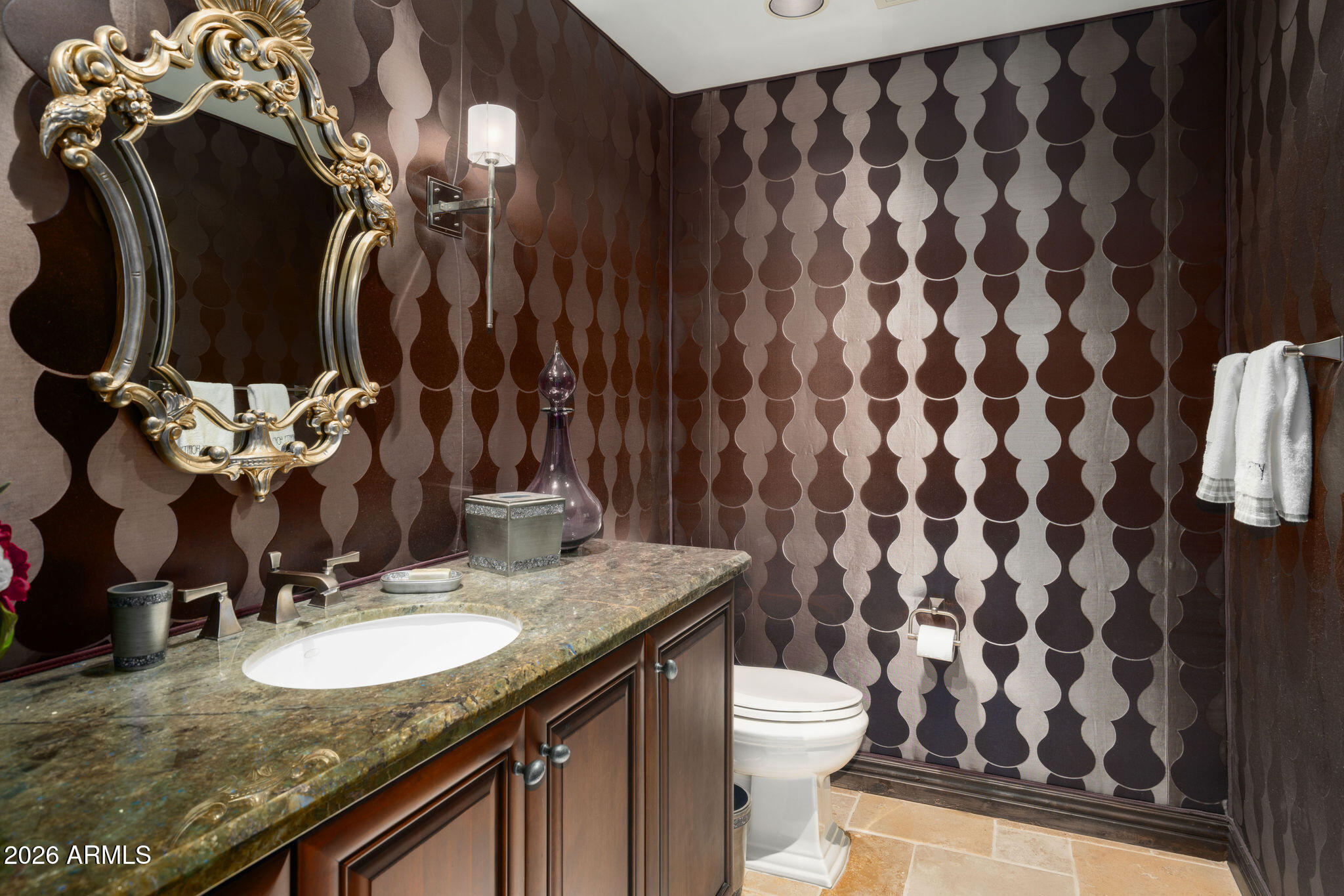 7181 East Camelback Road, Unit 1001 Scottsdale, AZ 85251 - Photo 12 of 34 a bathroom with a granite countertop sink a toilet and a mirror