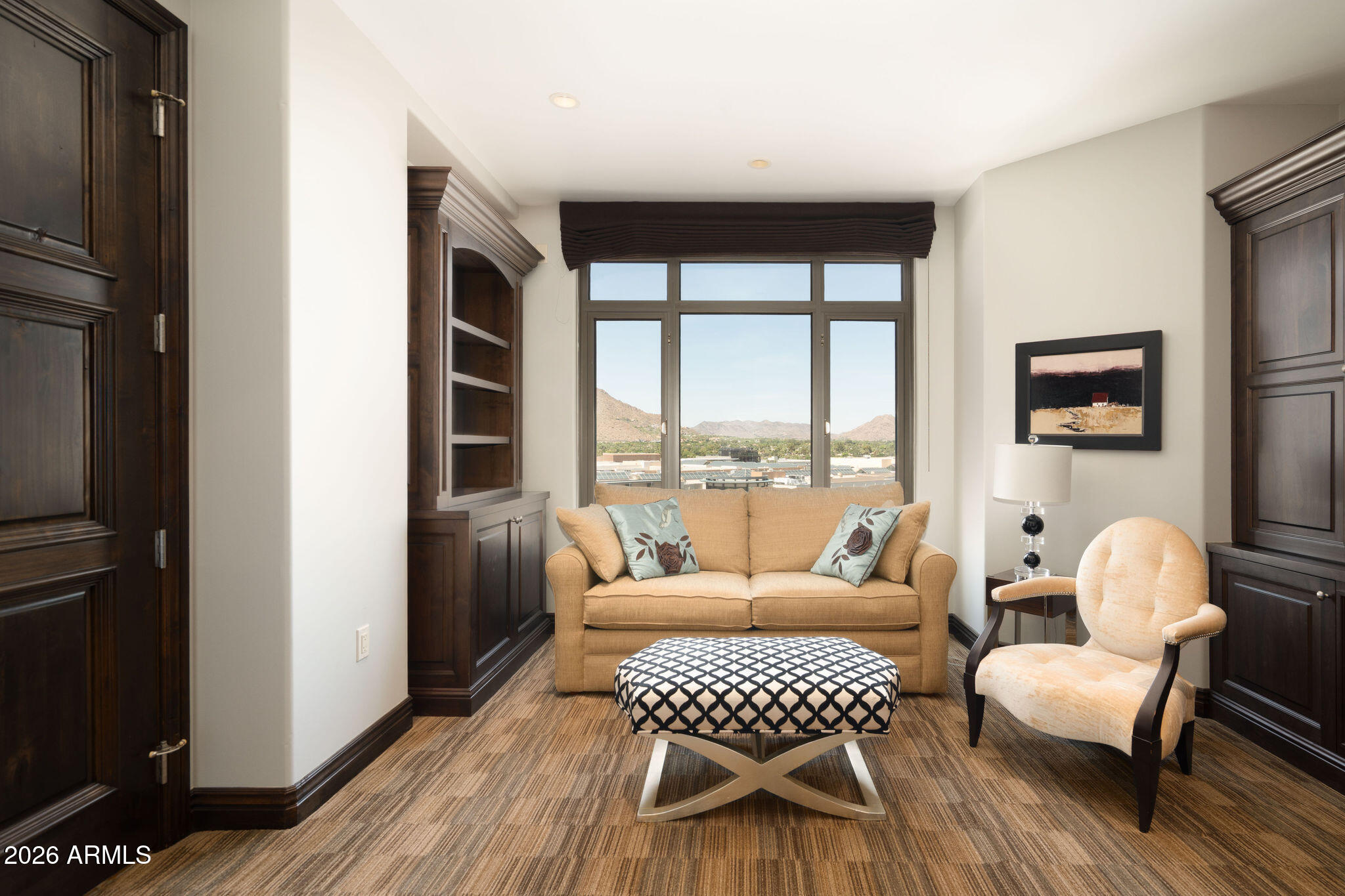 7181 East Camelback Road, Unit 1001 Scottsdale, AZ 85251 - Photo 16 of 34 a living room with furniture and a floor to ceiling window