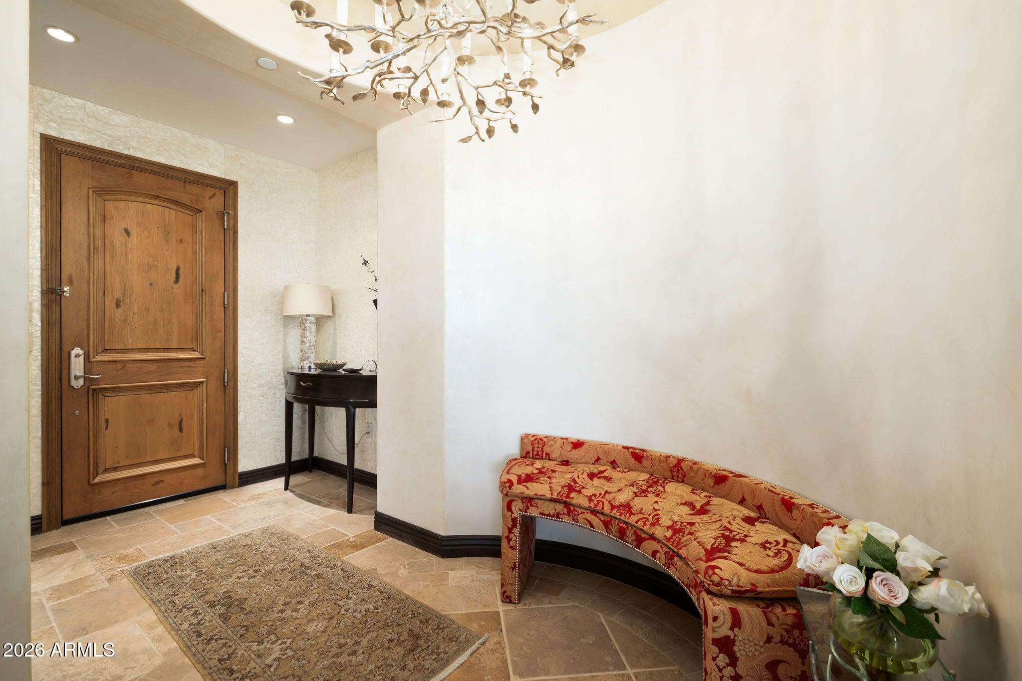 7181 East Camelback Road, Unit 1001 Scottsdale, AZ 85251 - Photo 2 of 34 a bedroom with a bed and a chandelier
