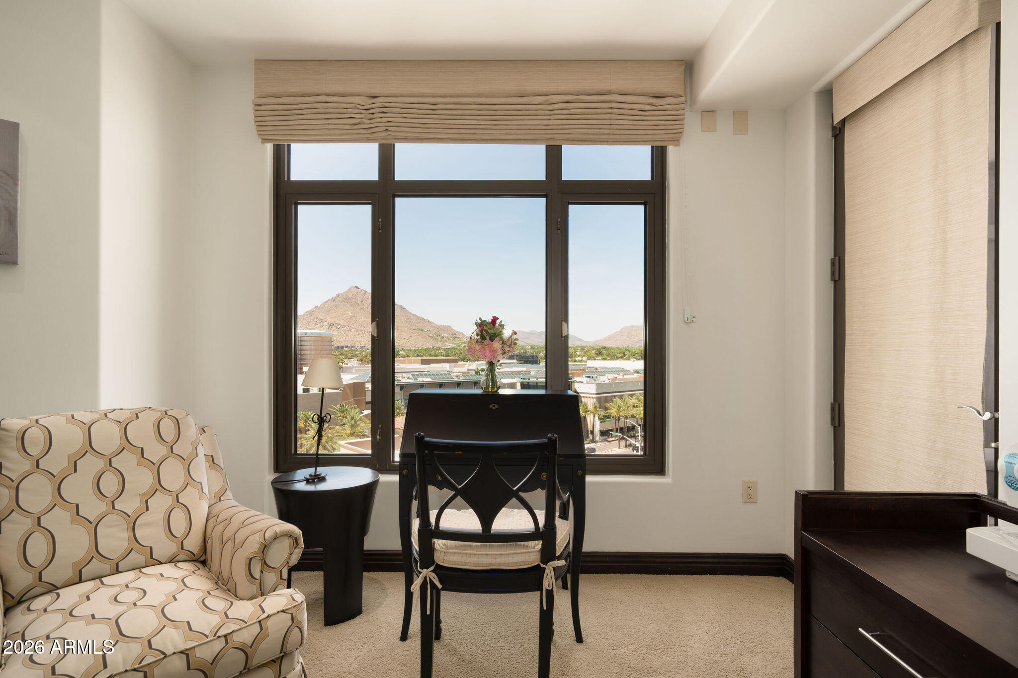 7181 East Camelback Road, Unit 1001 Scottsdale, AZ 85251 - Photo 21 of 34 a living room with furniture and a window