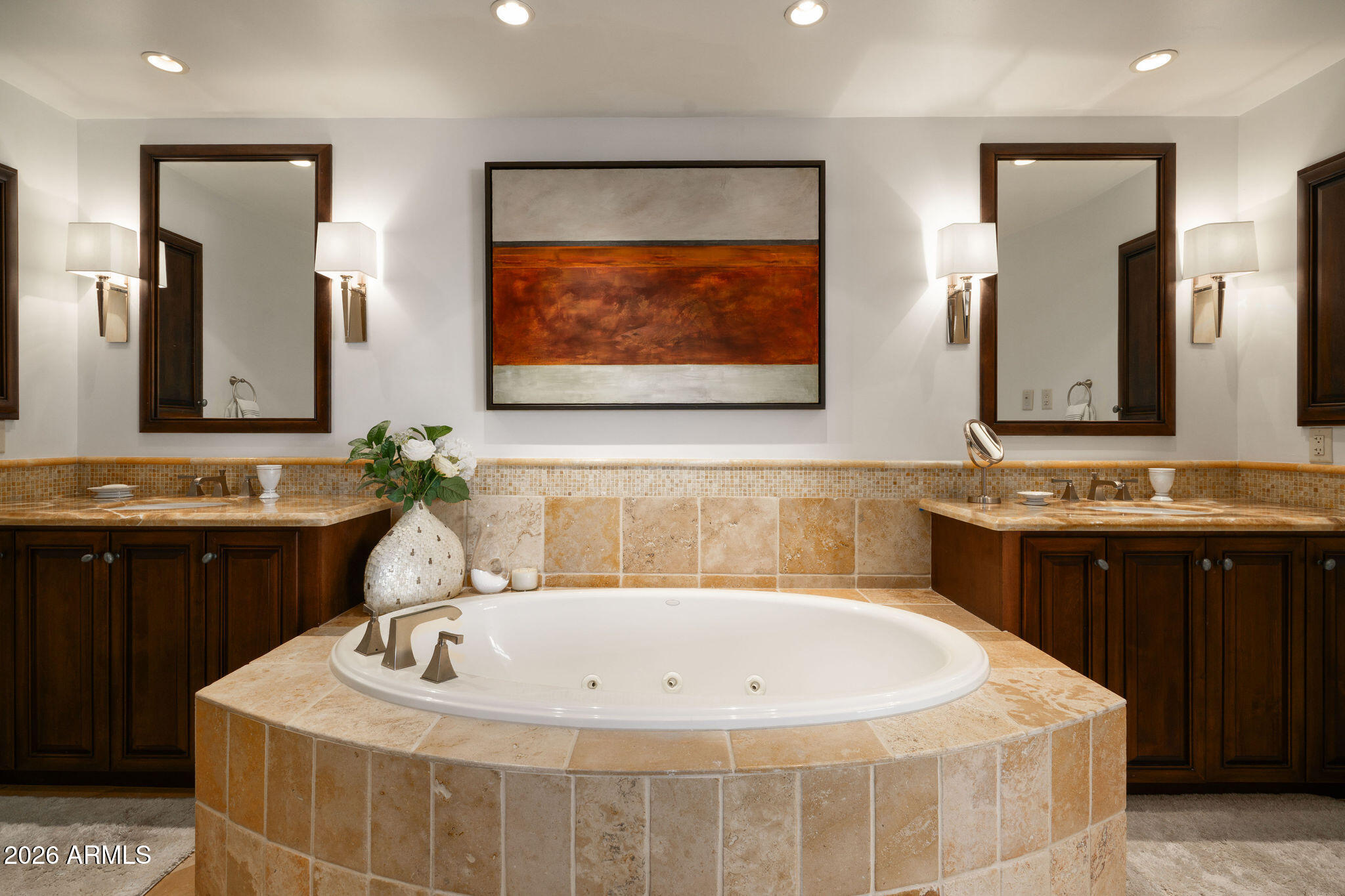 7181 East Camelback Road, Unit 1001 Scottsdale, AZ 85251 - Photo 23 of 34 a bath tub sitting next to a bathroom sink