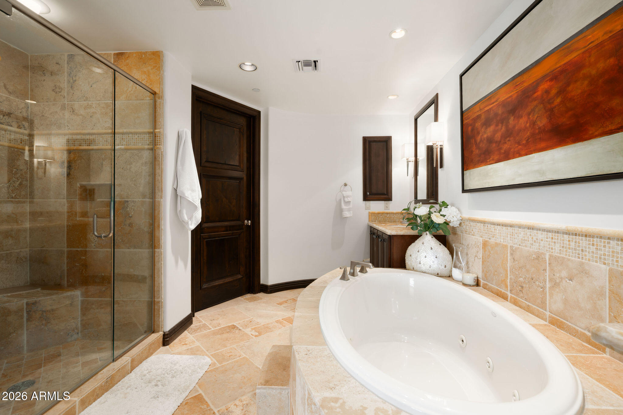 7181 East Camelback Road, Unit 1001 Scottsdale, AZ 85251 - Photo 24 of 34 a bathroom with a sink and a mirror
