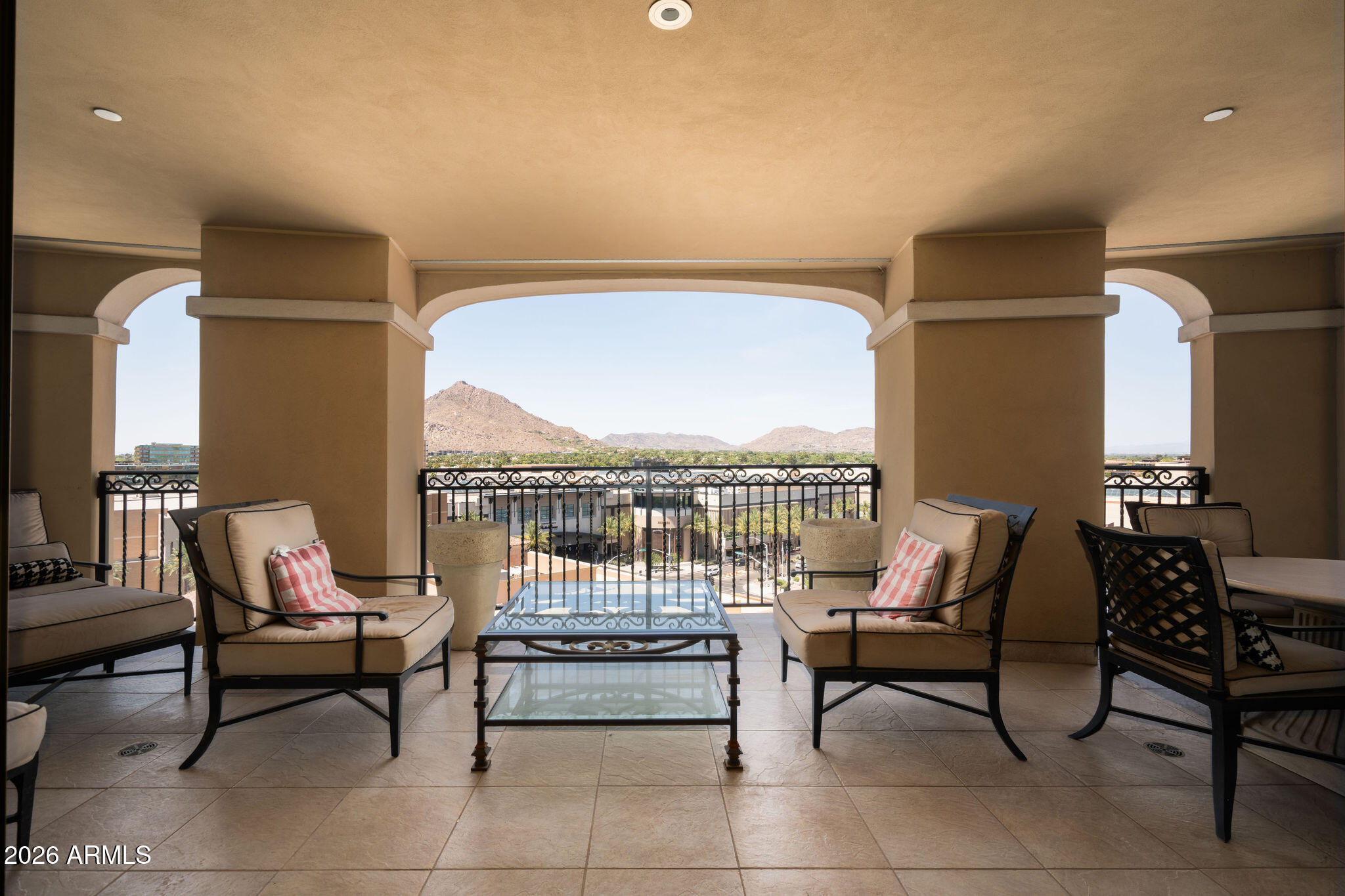 7181 East Camelback Road, Unit 1001 Scottsdale, AZ 85251 - Photo 26 of 34 a living room with furniture and a floor to ceiling window