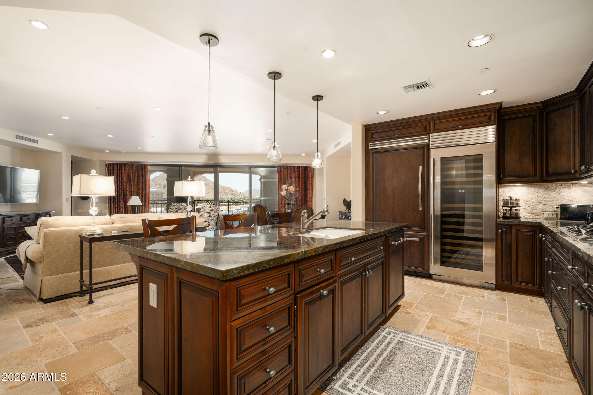 7181 East Camelback Road, Unit 1001 Scottsdale, AZ 85251 - Photo 6 of 34 a kitchen with stainless steel appliances granite countertop a stove a sink and a refrigerator