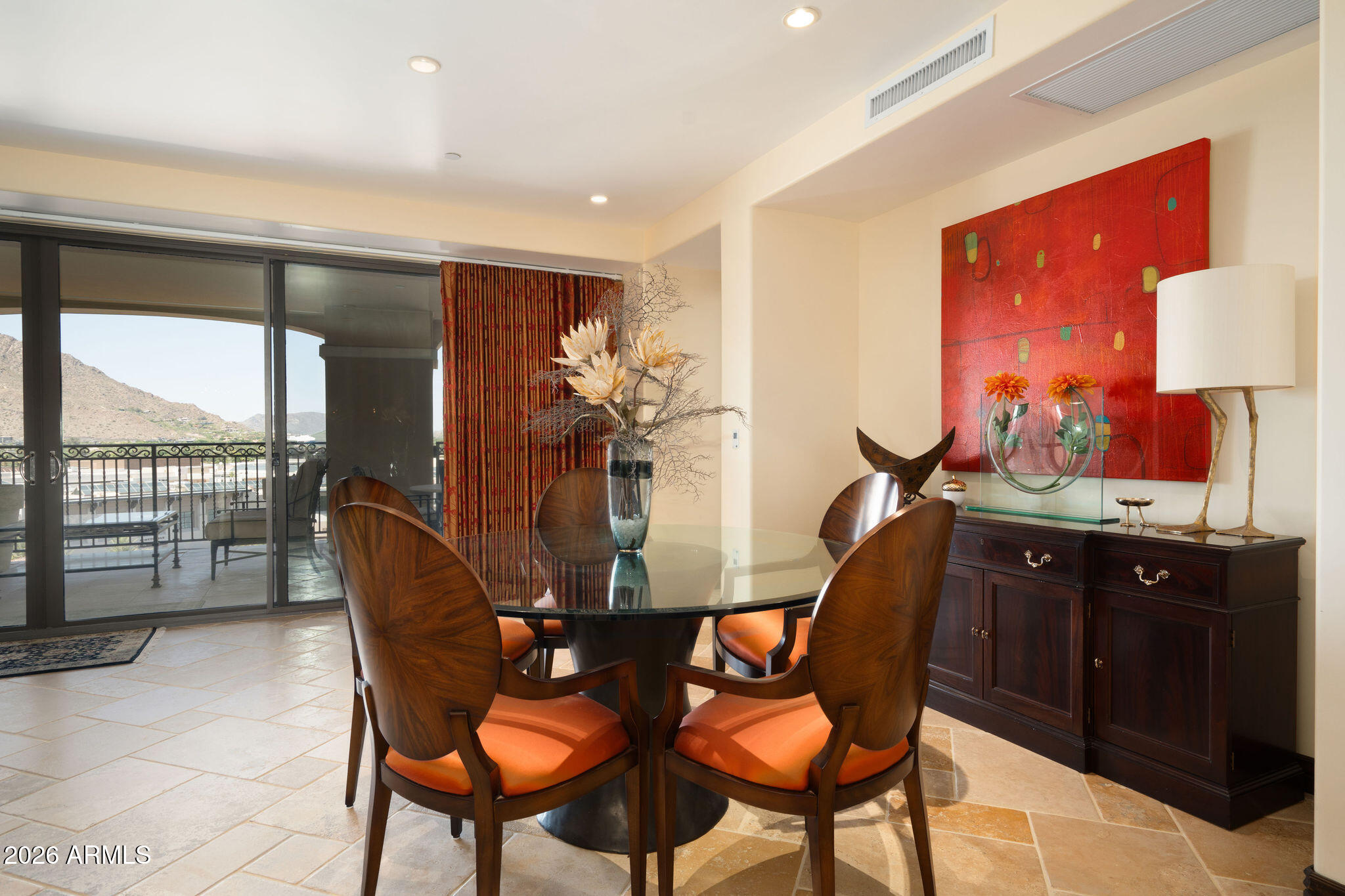 7181 East Camelback Road, Unit 1001 Scottsdale, AZ 85251 - Photo 7 of 34 a dining room with furniture and a floor to ceiling window
