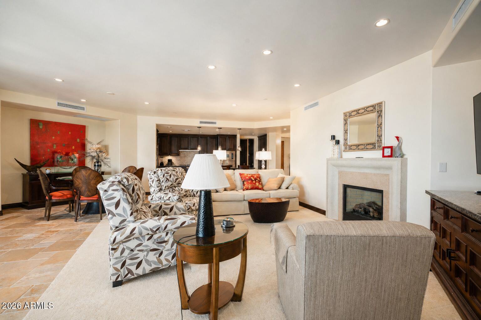 7181 East Camelback Road, Unit 1001 Scottsdale, AZ 85251 - Photo 9 of 34 a living room with furniture a fireplace and city view