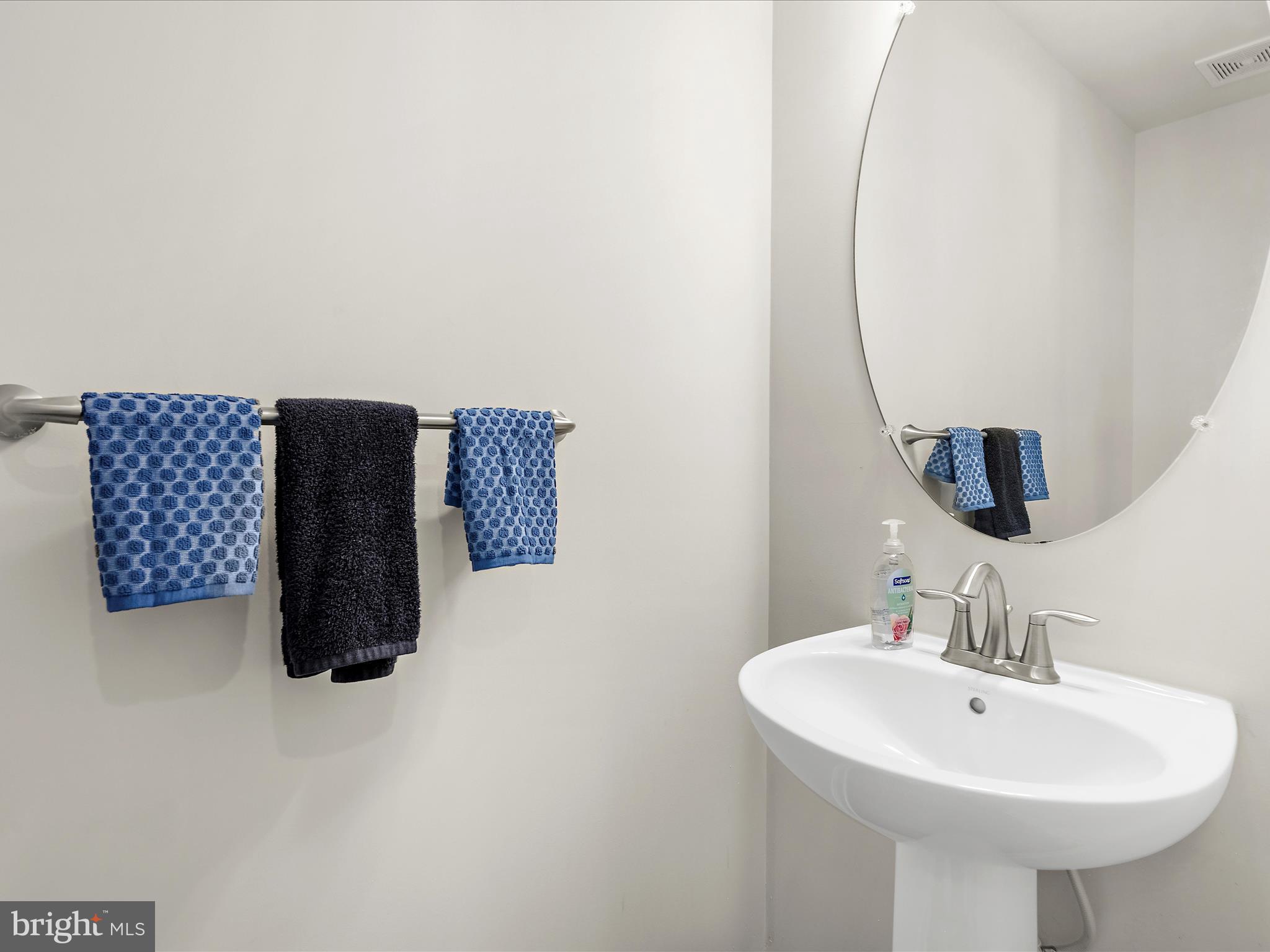 1239 Orchid Road Gambrills, MD 21054 - Photo 13 of 58 a bathroom with a sink and a mirror