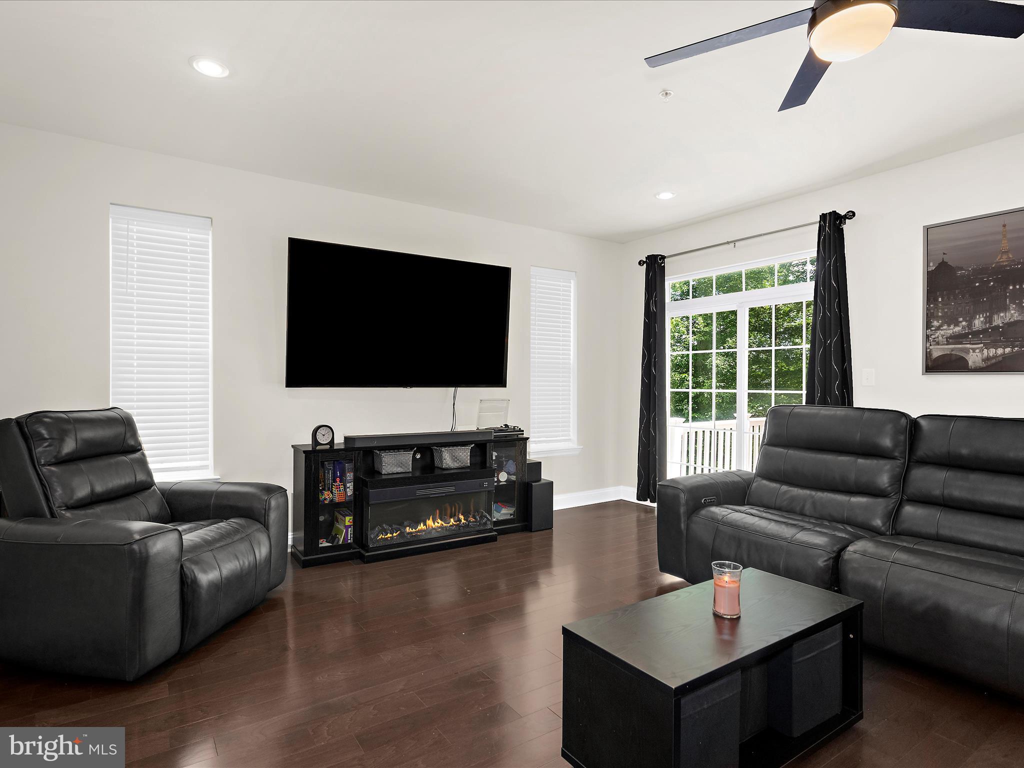 1239 Orchid Road Gambrills, MD 21054 - Photo 14 of 58 a living room with furniture and a flat screen tv
