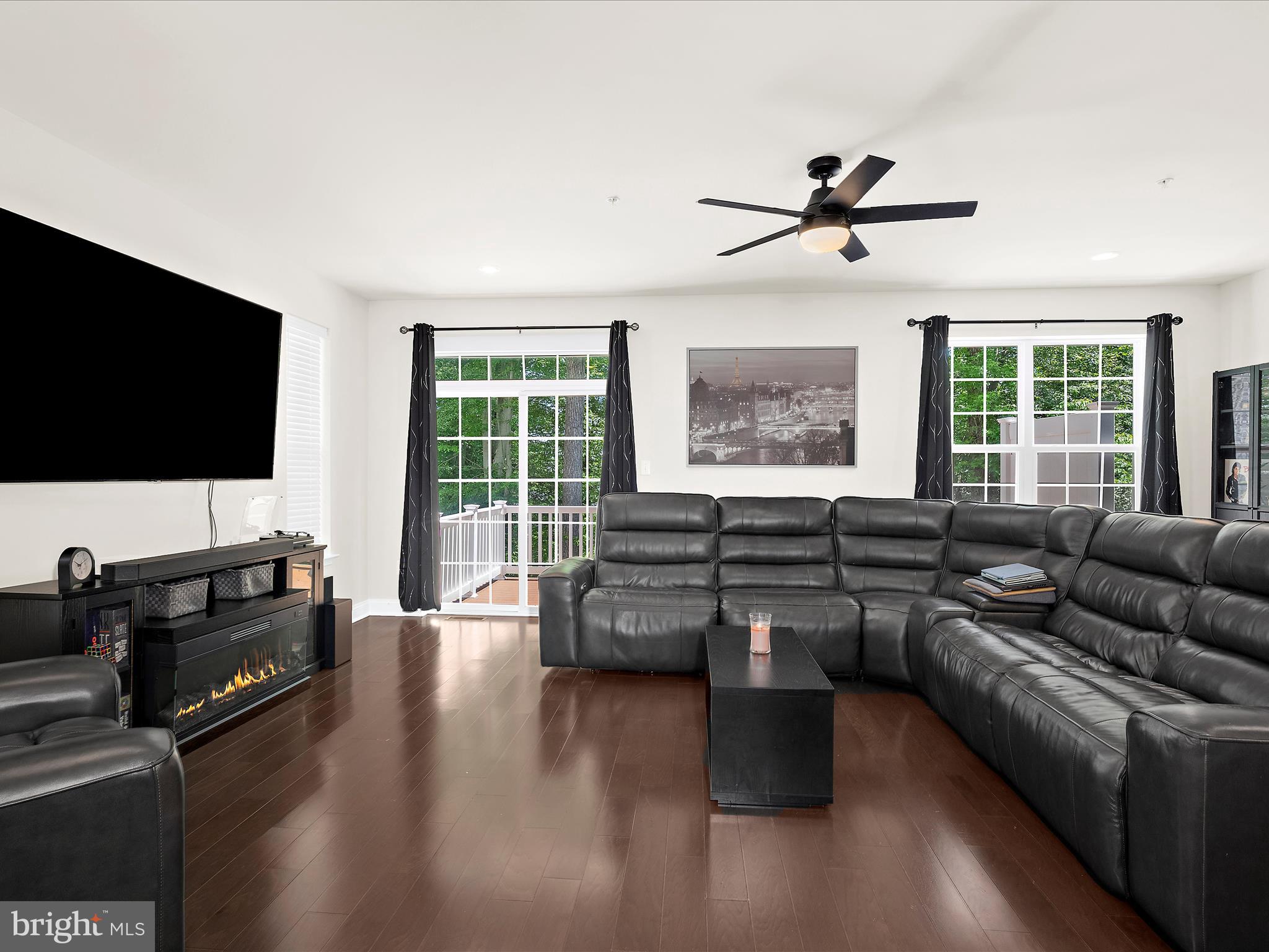 1239 Orchid Road Gambrills, MD 21054 - Photo 15 of 58 a living room with furniture and a flat screen tv