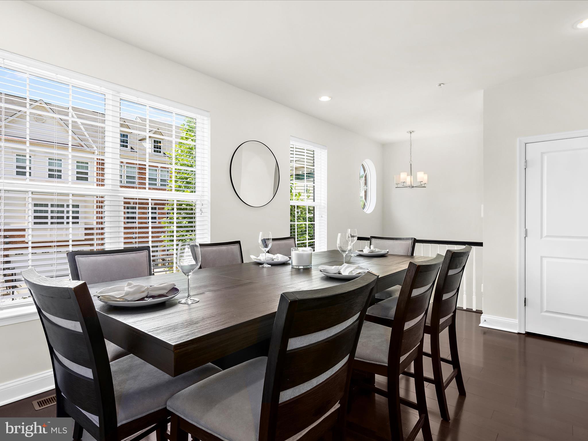 1239 Orchid Road Gambrills, MD 21054 - Photo 16 of 58 a view of a dining room with furniture and wooden floor