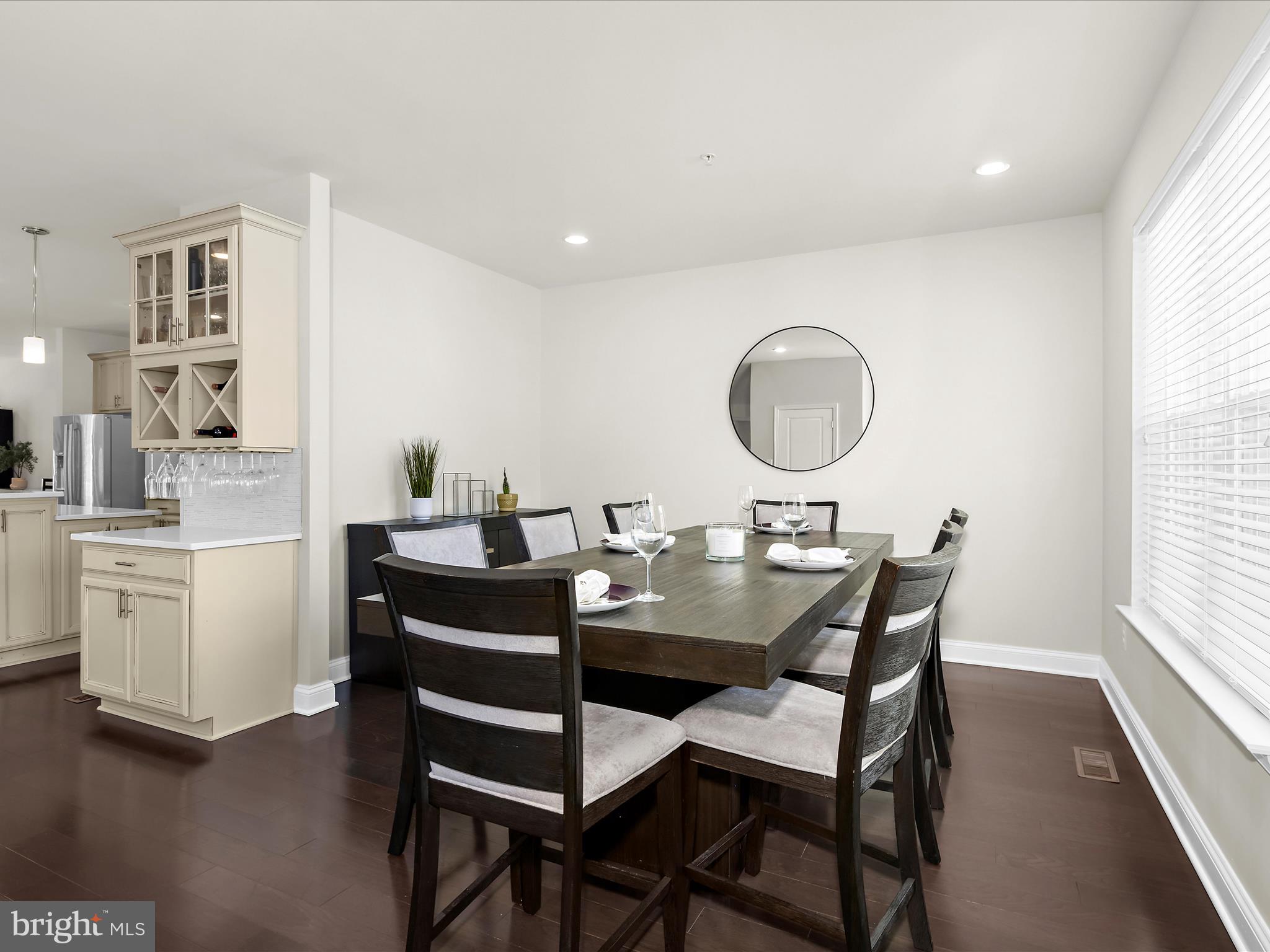 1239 Orchid Road Gambrills, MD 21054 - Photo 18 of 58 a view of a dining room with furniture and a window
