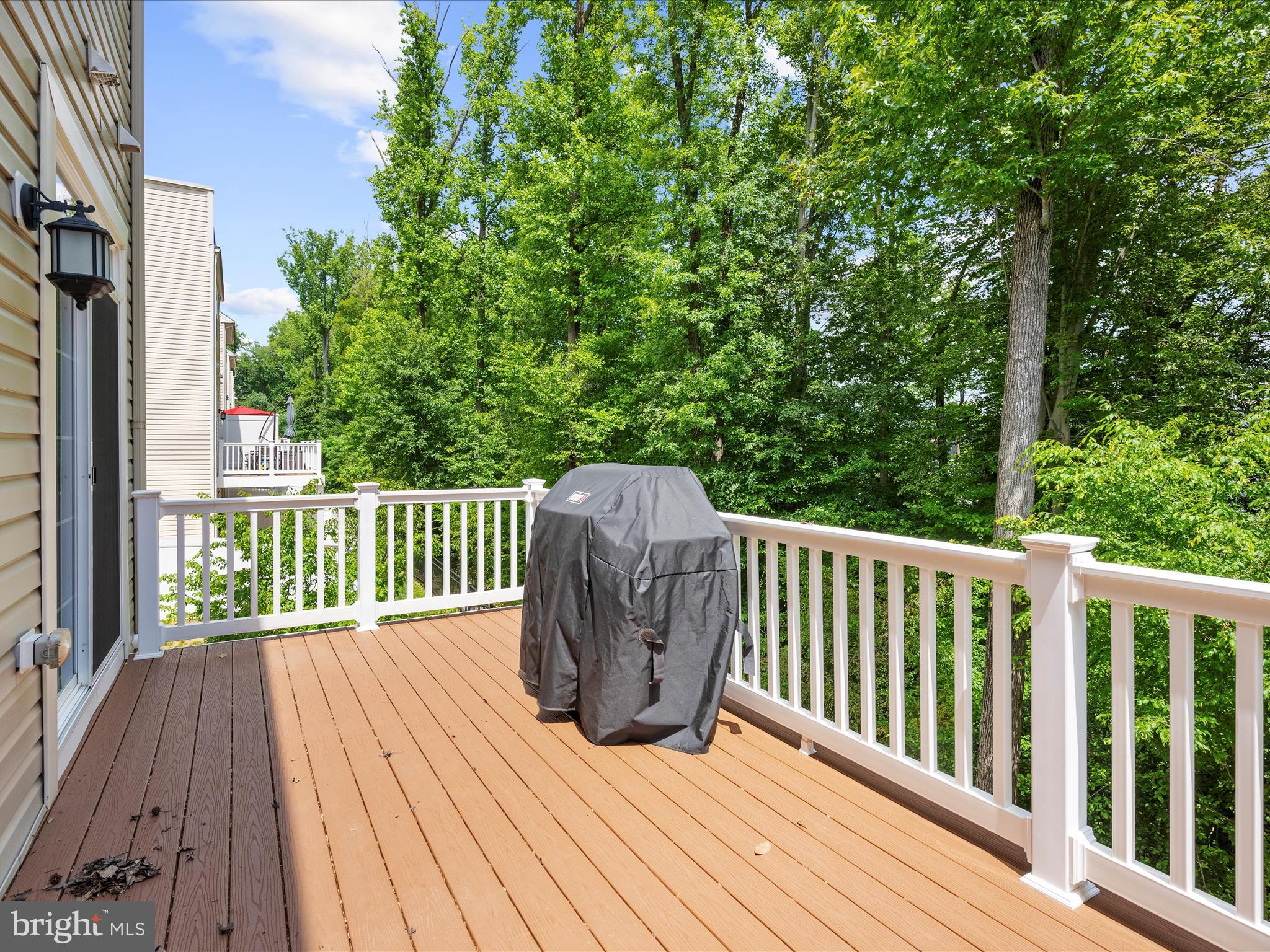 1239 Orchid Road Gambrills, MD 21054 - Photo 20 of 58 a balcony with wooden floor and fence