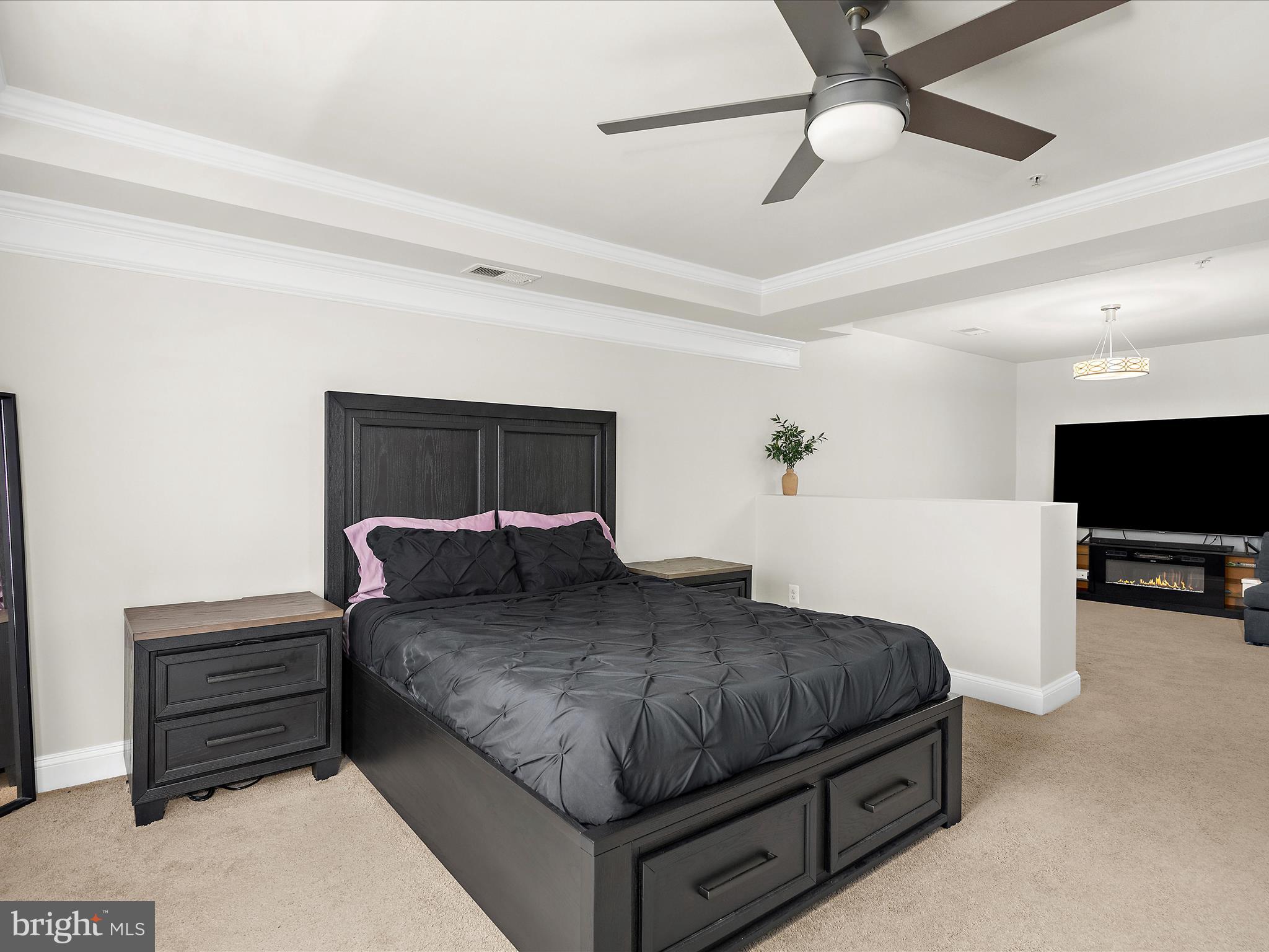 1239 Orchid Road Gambrills, MD 21054 - Photo 23 of 58 a bedroom with a bed and a tv on the dresser