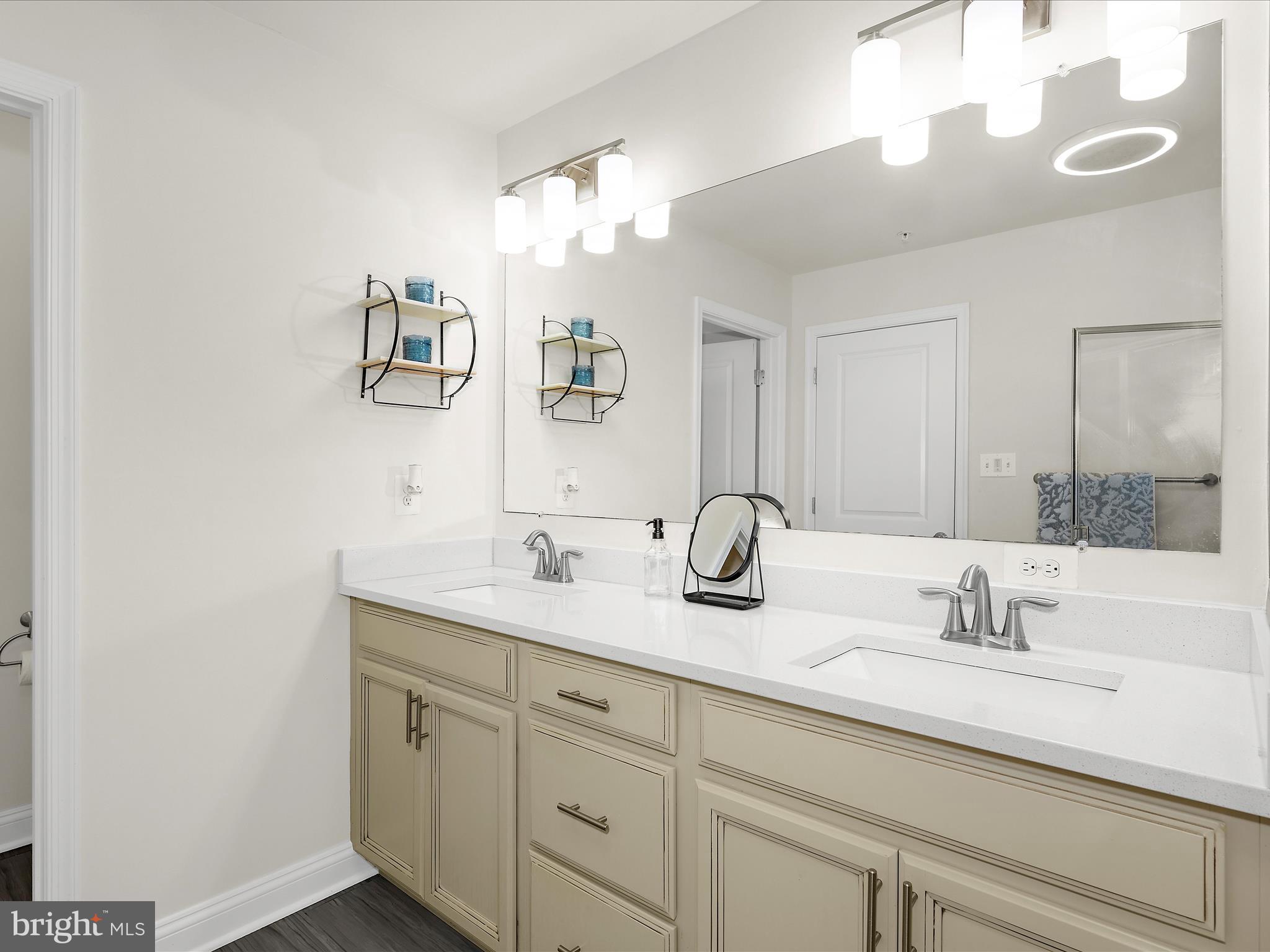 1239 Orchid Road Gambrills, MD 21054 - Photo 26 of 58 a bathroom with a sink and a mirror