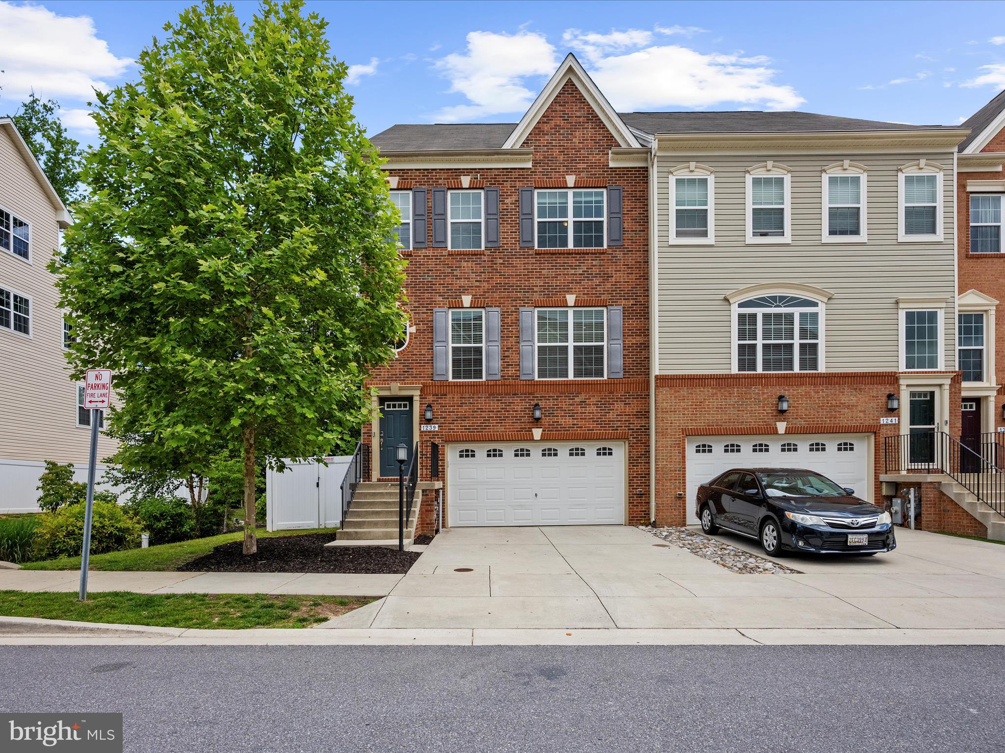 1239 Orchid Road Gambrills, MD 21054 - Photo 3 of 58 a front view of a house with a yard
