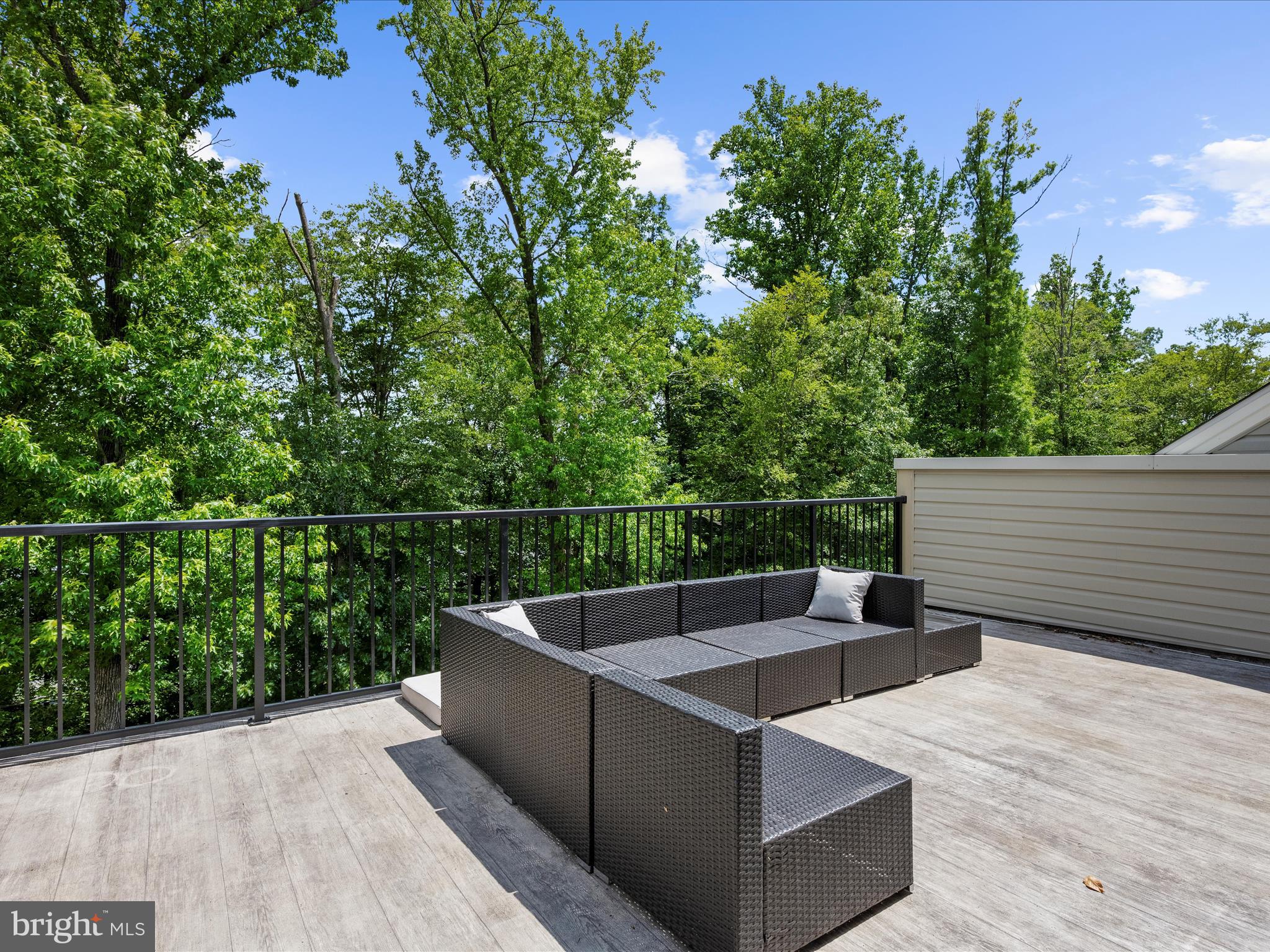 1239 Orchid Road Gambrills, MD 21054 - Photo 36 of 58 a view of roof deck with wooden floor and fence