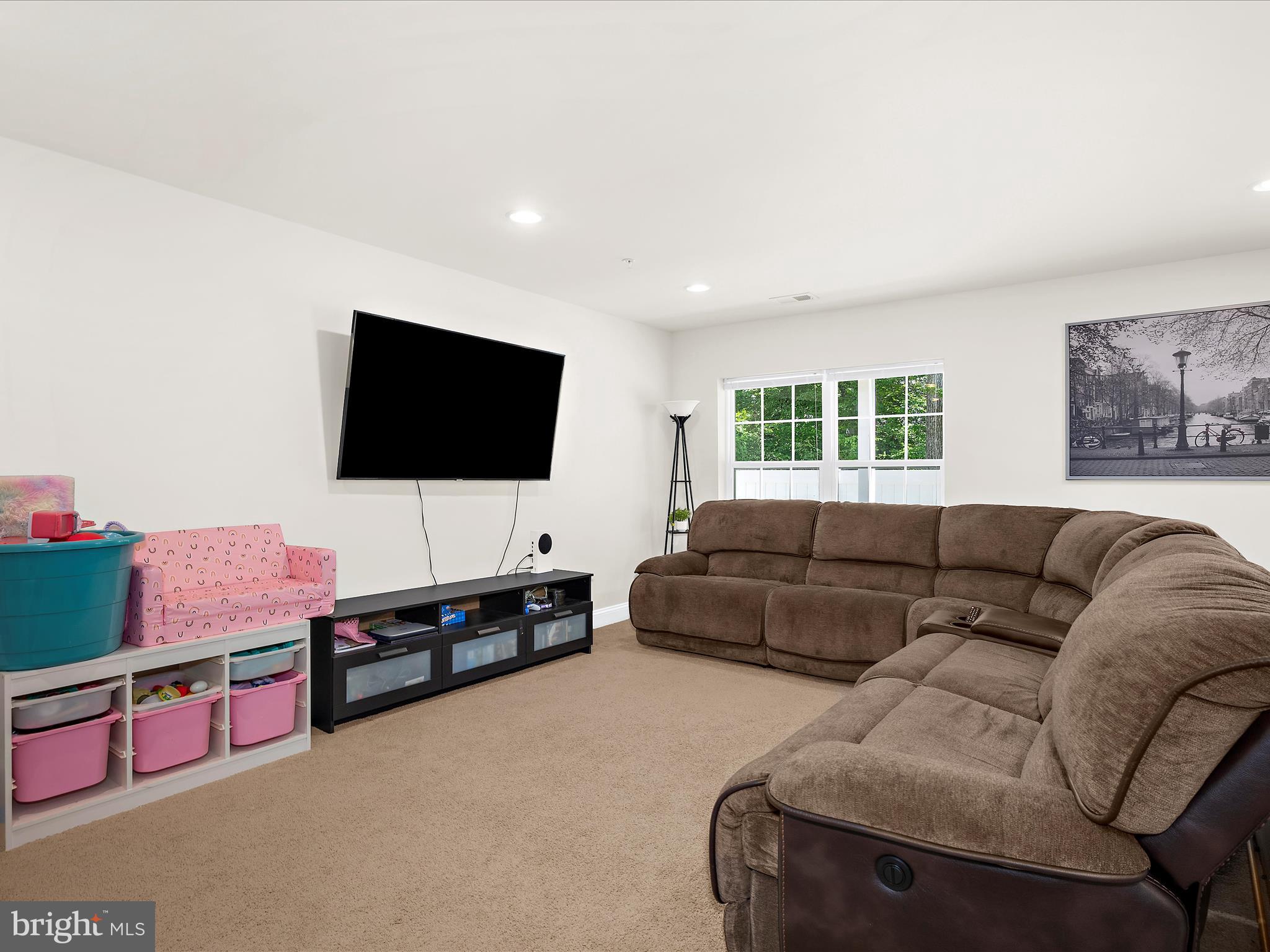 1239 Orchid Road Gambrills, MD 21054 - Photo 39 of 58 a living room with furniture and a flat screen tv