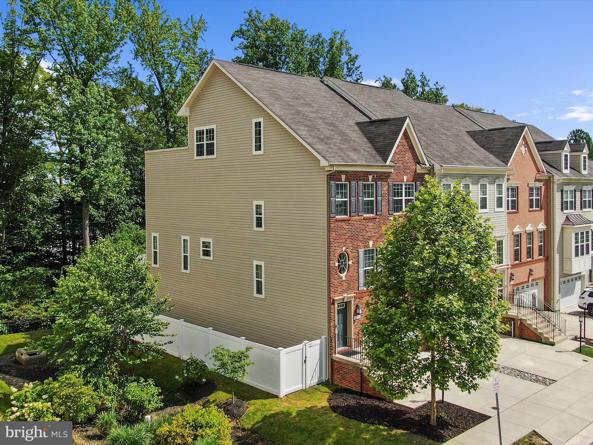 1239 Orchid Road Gambrills, MD 21054 - Photo 4 of 58 front view of a house with a garden