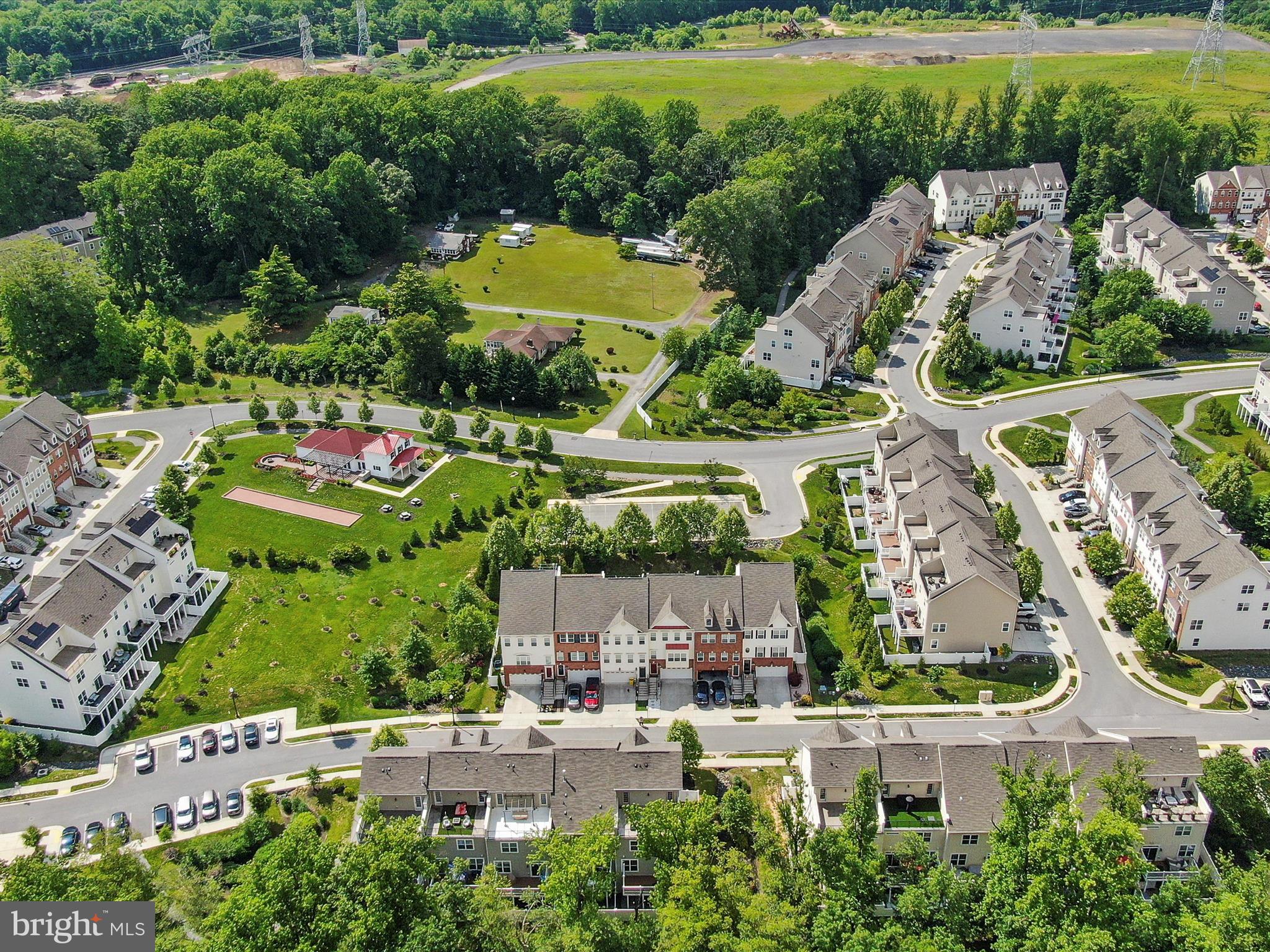 1239 Orchid Road Gambrills, MD 21054 - Photo 45 of 58 an aerial view of a house with a garden and lake view