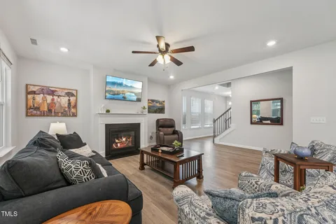 a living room with furniture a fireplace