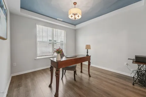 a workspace with furniture and a window